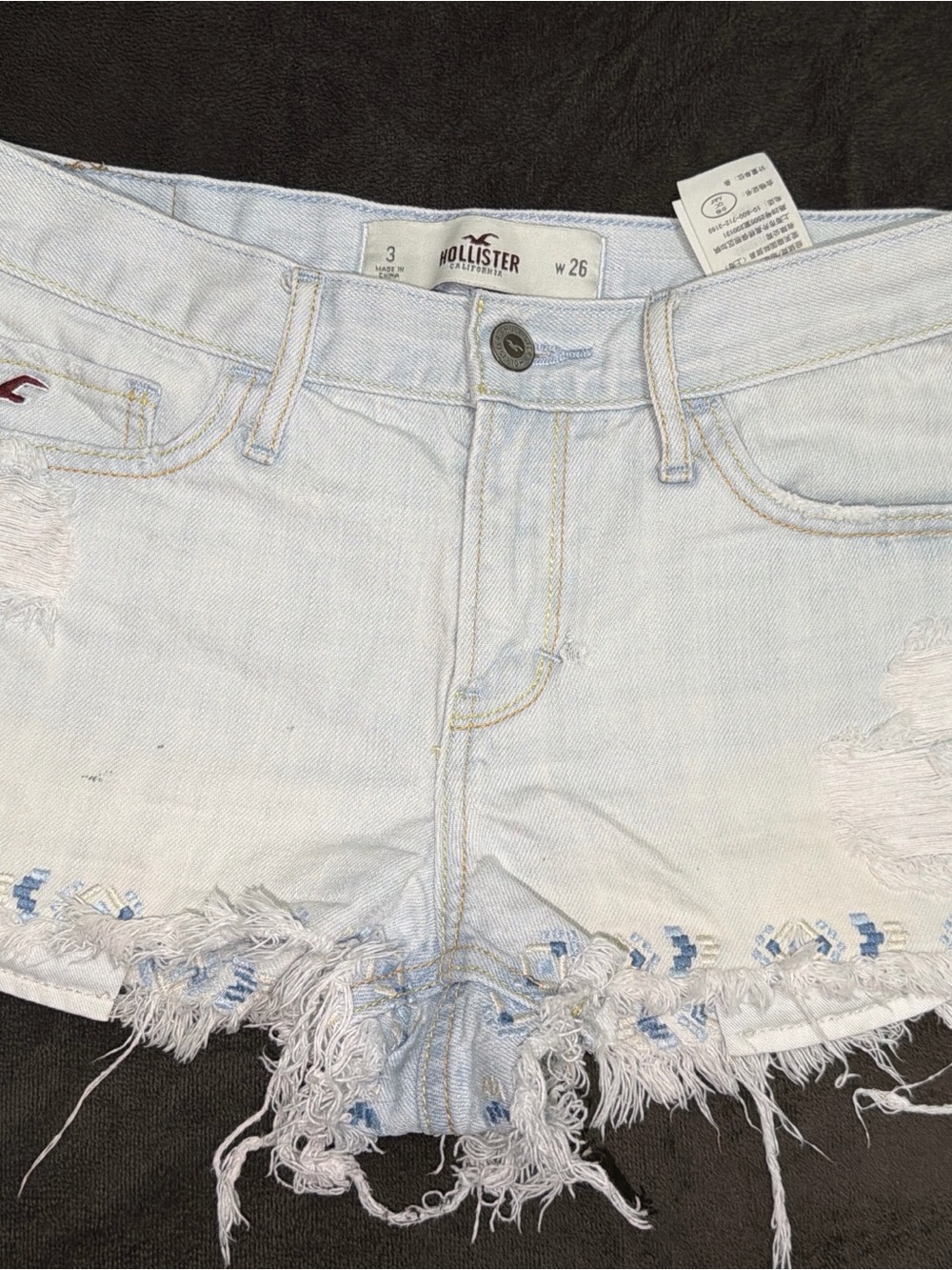Hollister Light Wash Frayed Denim Shorts with Subtle Blue Embroidery